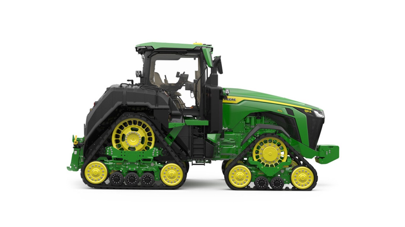 Right-facing studio shot of a 4-tracked green tractor on a white background.