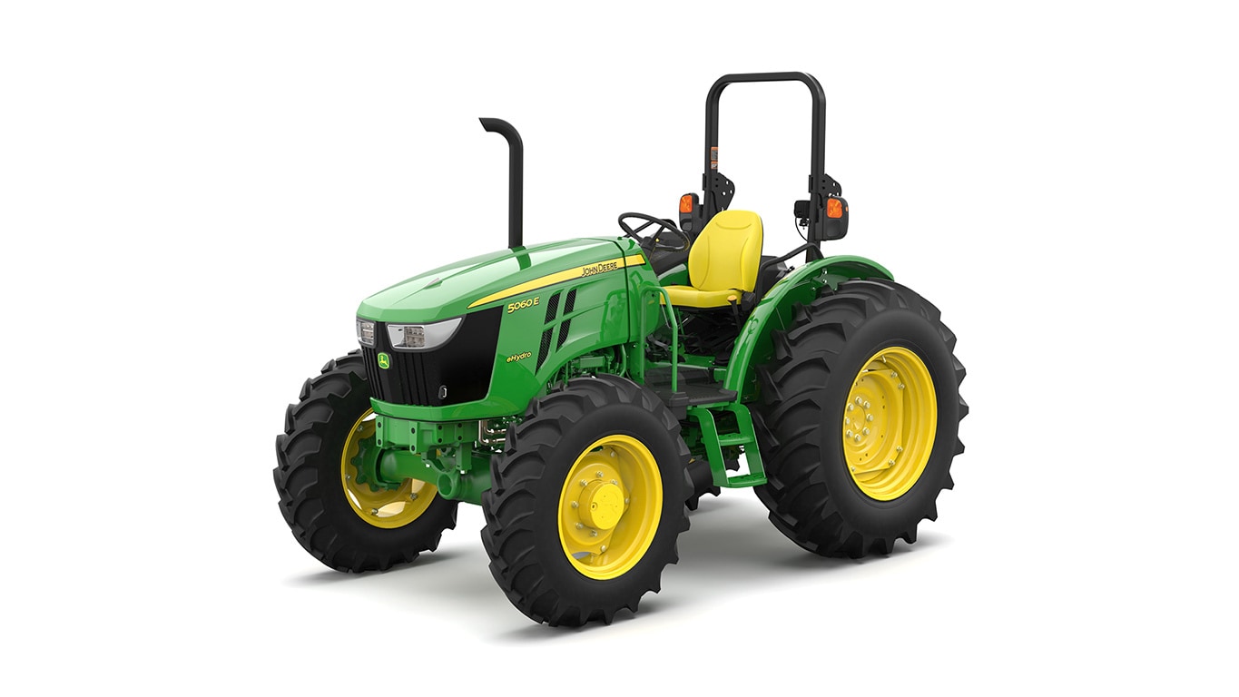 Tracteur utilitaire vert sur fond blanc.