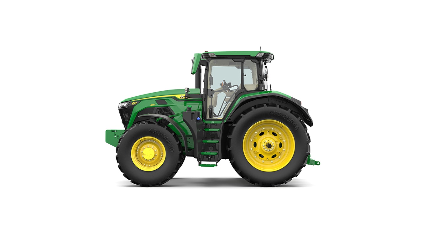 Studio shot of a left-facing cabbed green tractor on a white background.