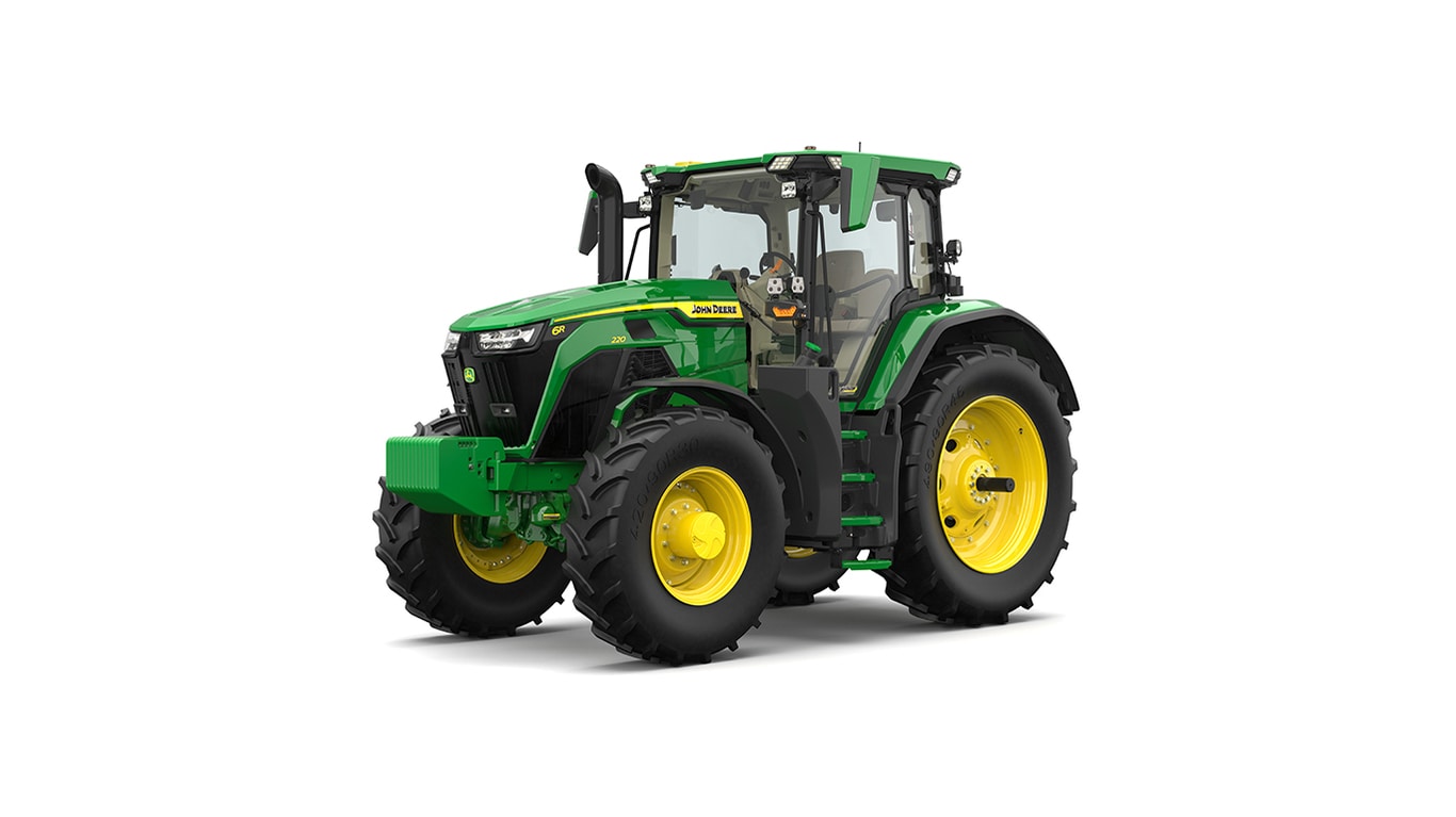 Studio shot of a front-left-facing cabbed green tractor on a white background.