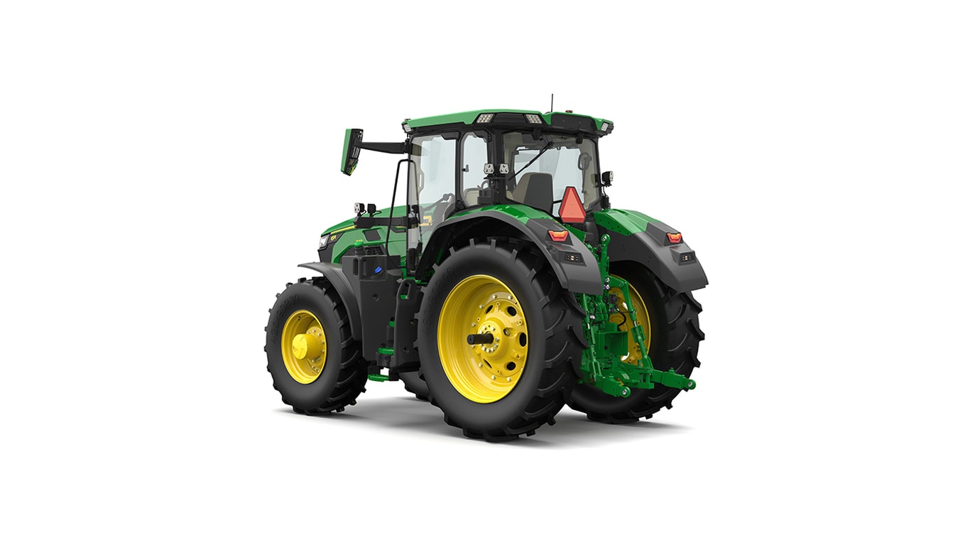 Studio shot of a rear-left-facing cabbed green tractor on a white background.