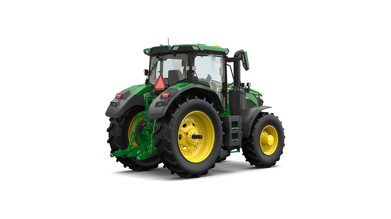 Studio shot of a rear-right-facing cabbed green tractor on a white background.