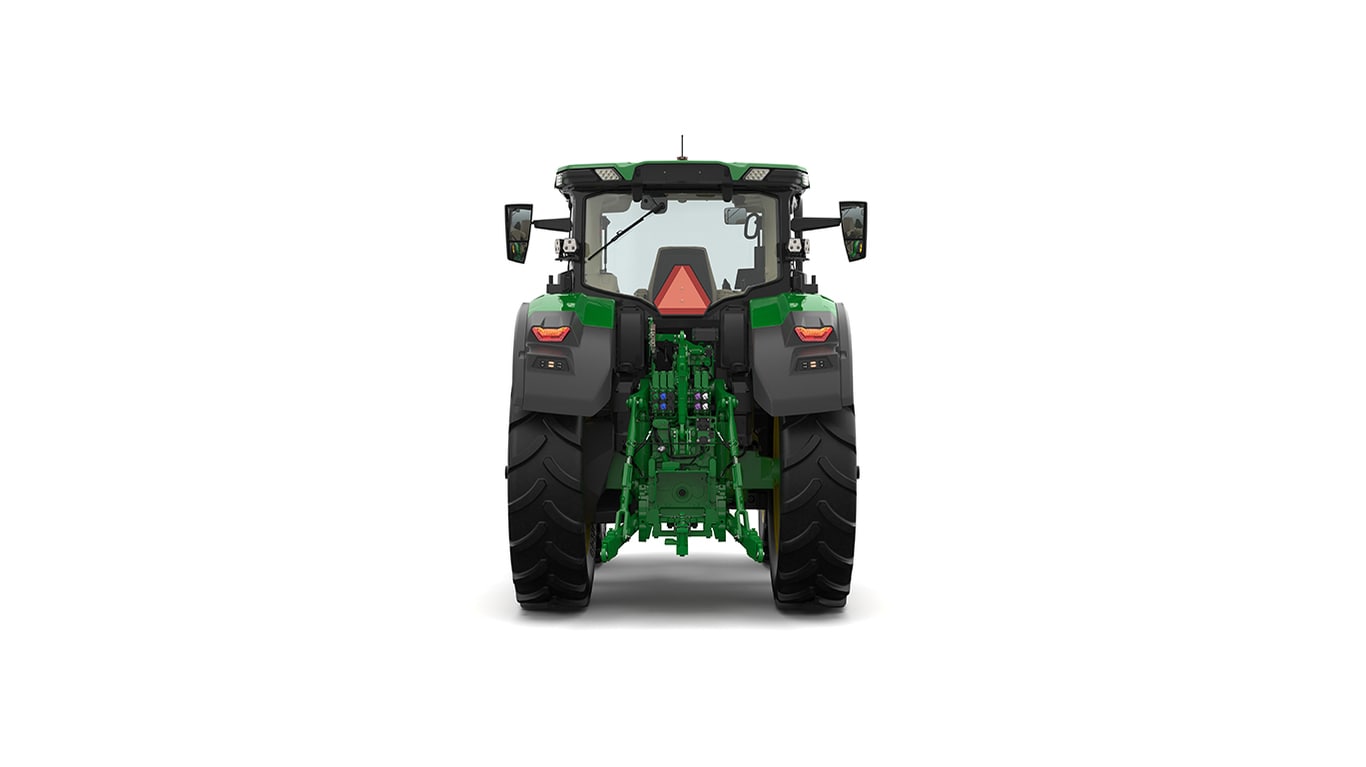 Studio shot of a rear-facing cabbed green tractor on a white background.