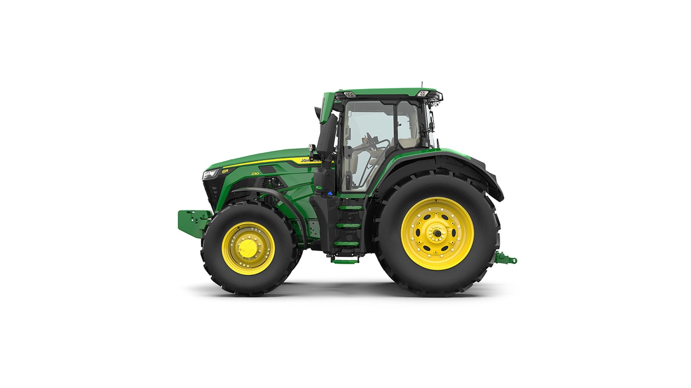 Studio shot of a left-facing cabbed green tractor on a white background.