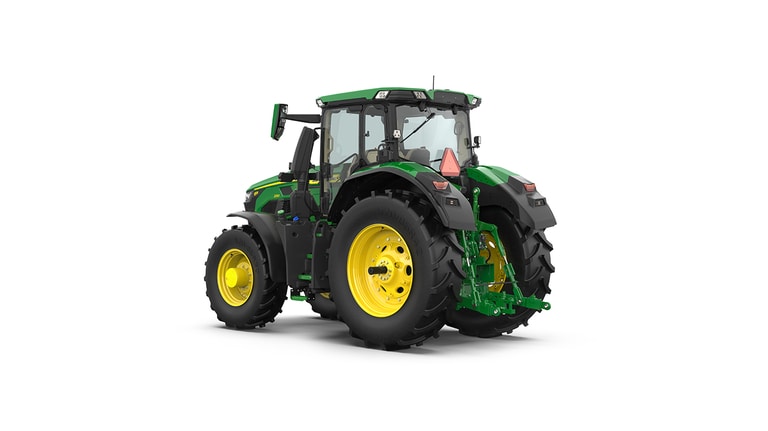 Studio shot of a rear-left-facing cabbed green tractor on a white background.