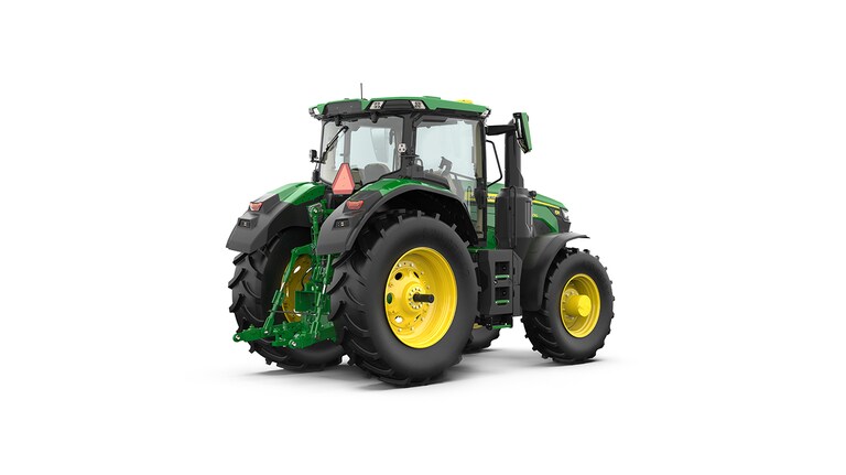 Studio shot of a rear-right-facing cabbed green tractor on a white background.