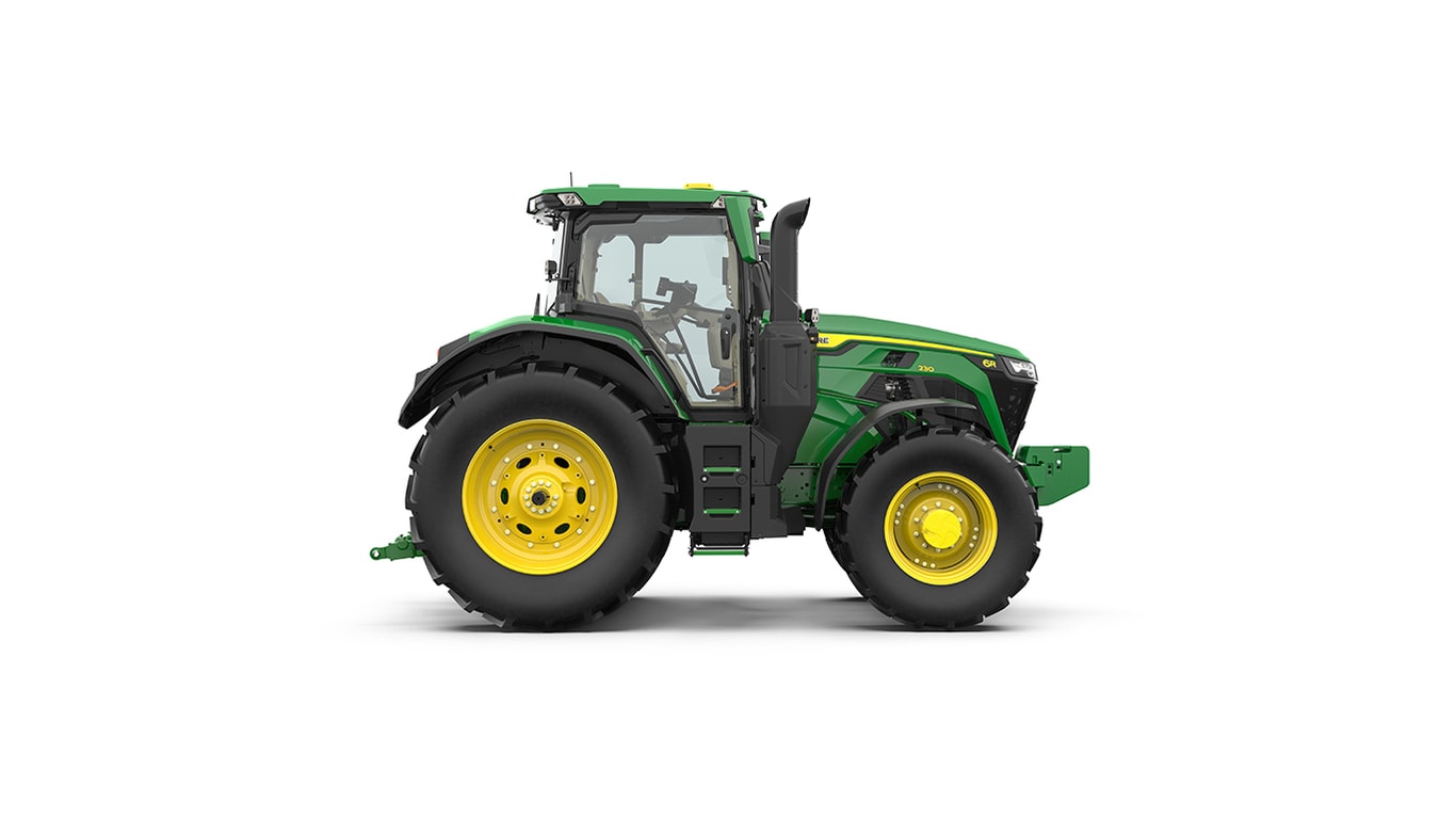 Studio shot of a right-facing cabbed green tractor on a white background.