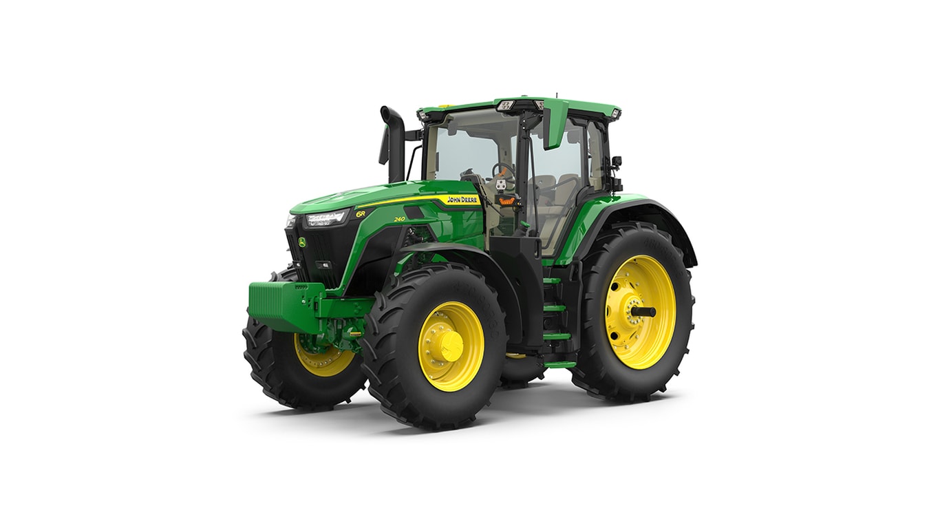 Studio shot of a front-left-facing cabbed green tractor on a white background.