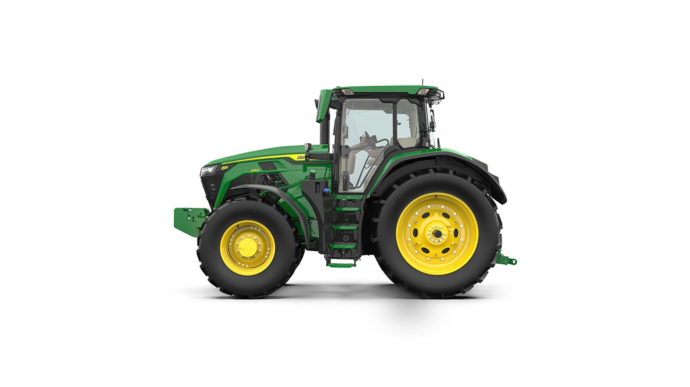 Studio shot of a left-facing cabbed green tractor on a white background.