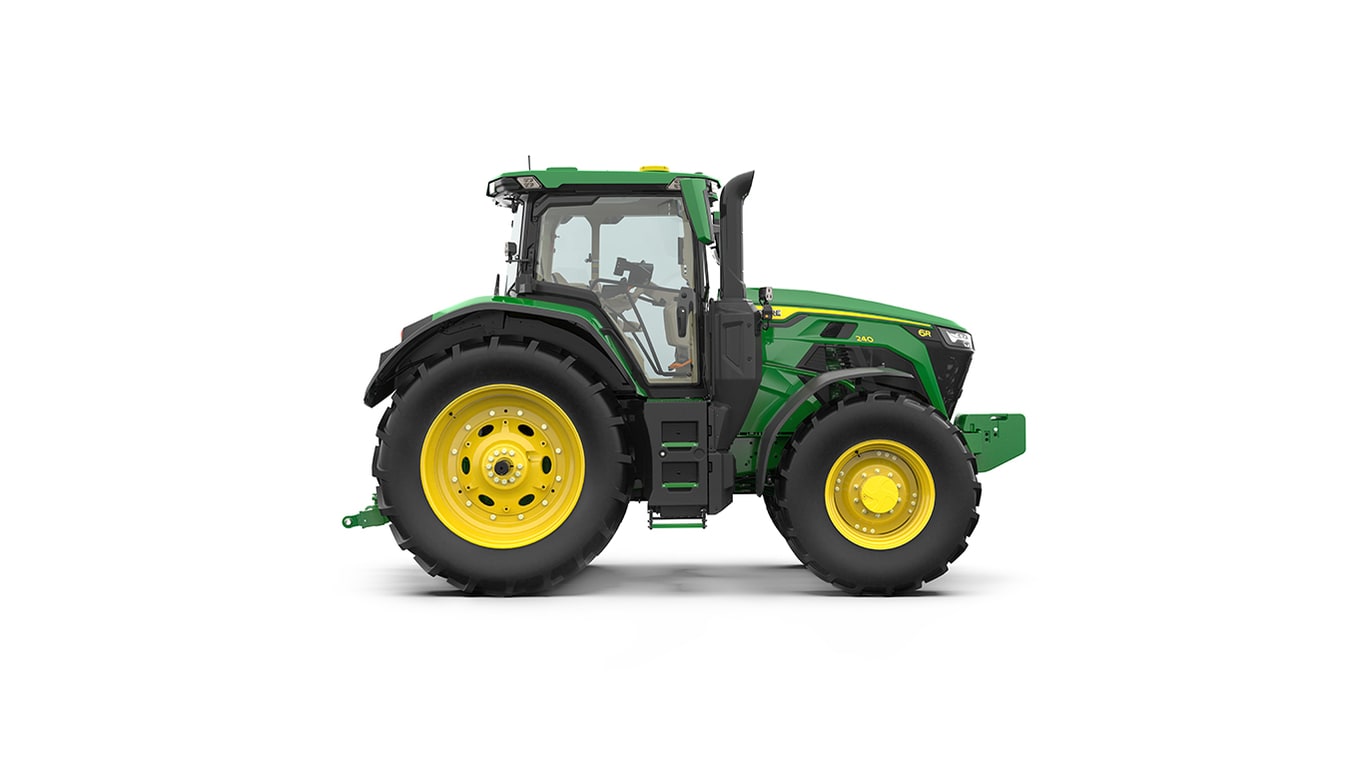Studio shot of a right-facing cabbed green tractor on a white background.
