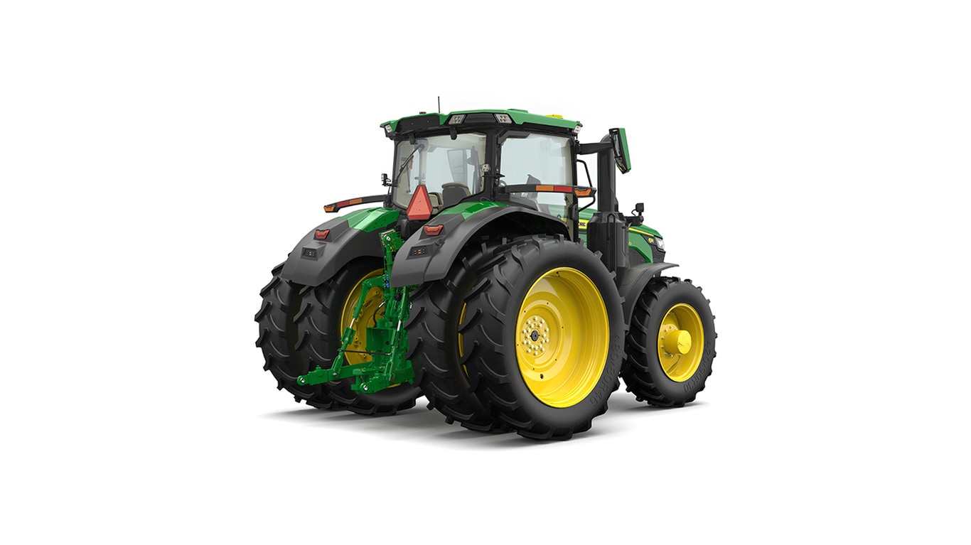 Studio shot of a rear-right-facing cabbed green tractor on a white background.