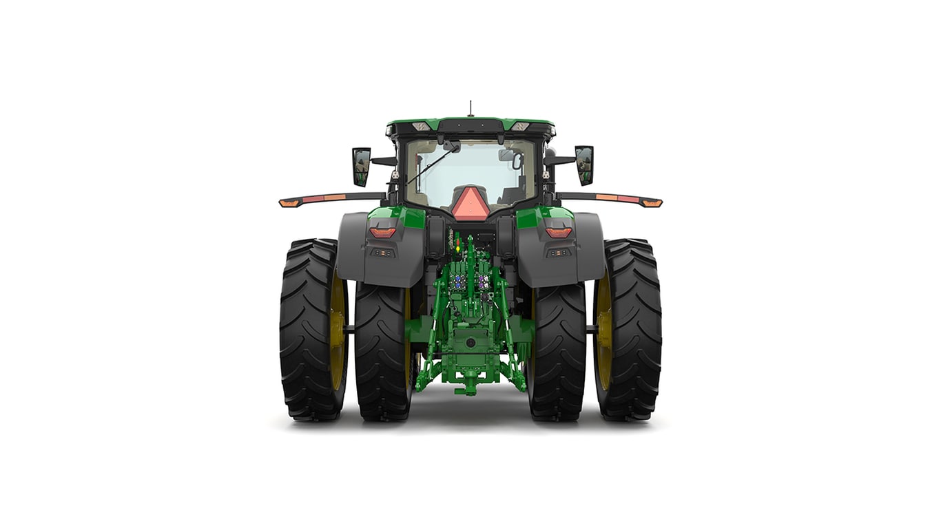 Studio shot of a rear-facing cabbed green tractor on a white background.
