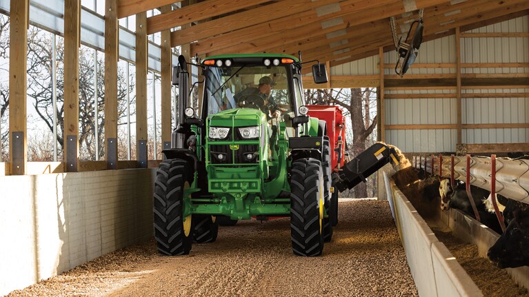 image of 6m tractor feeding cattle