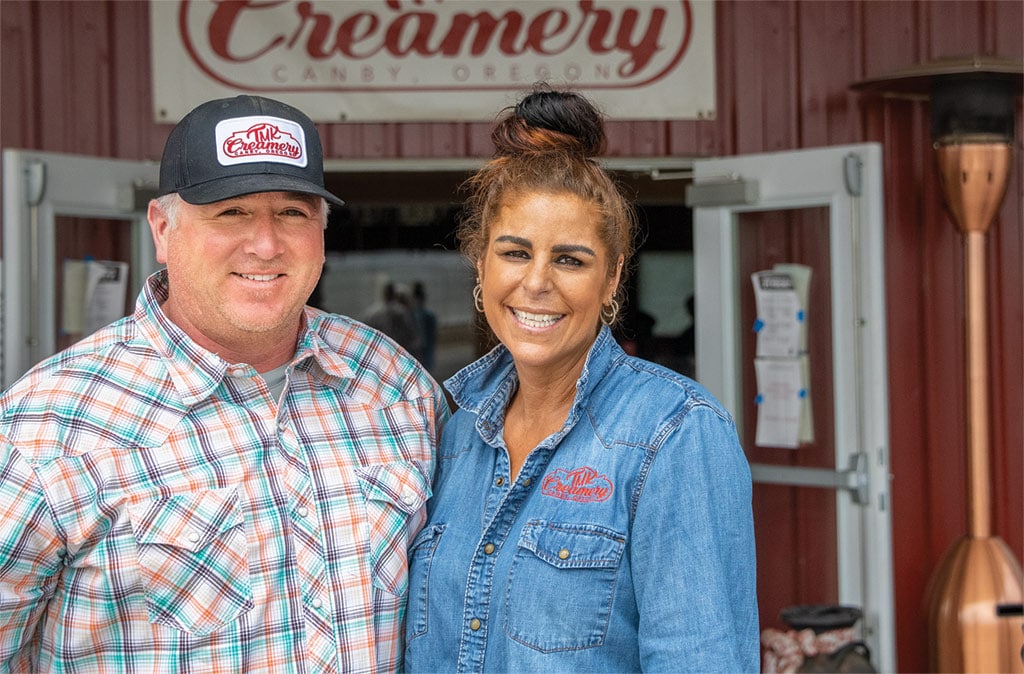 Todd and Tessa Koch Standing in front of Creamery