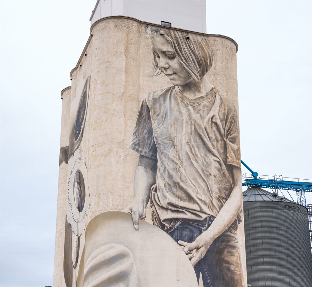 mural of cowgirl on side of building