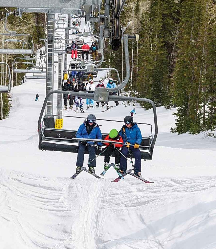 Skiers in ski lift
