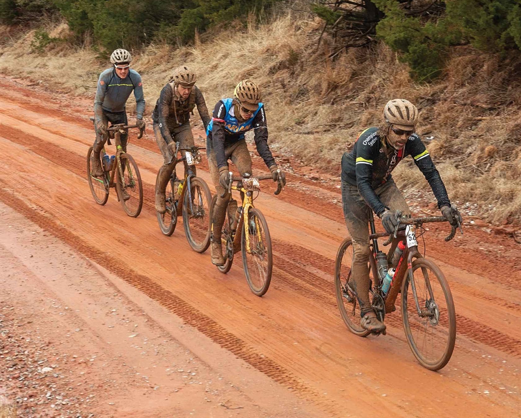 Cyclists on clay road