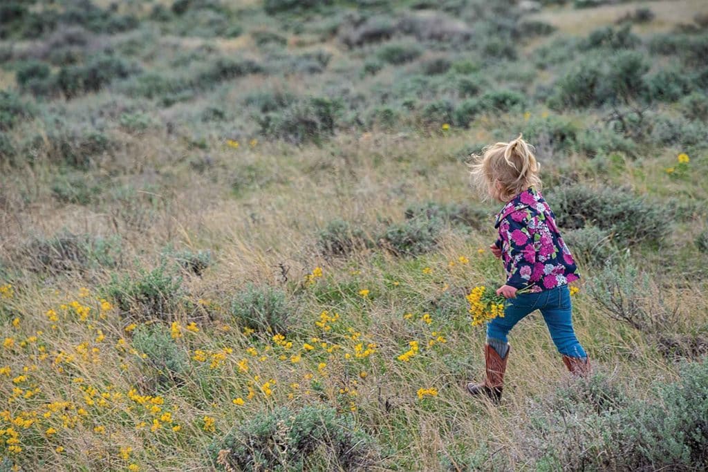 Girl gathering blooms