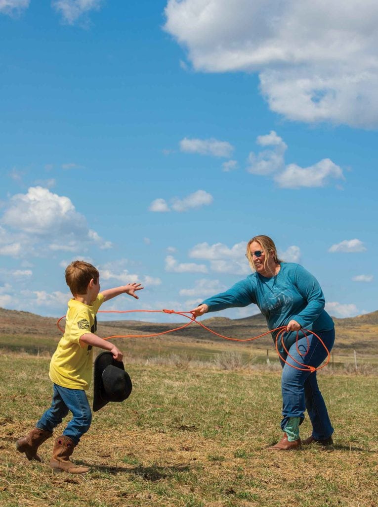 Mother and son playing with lasso