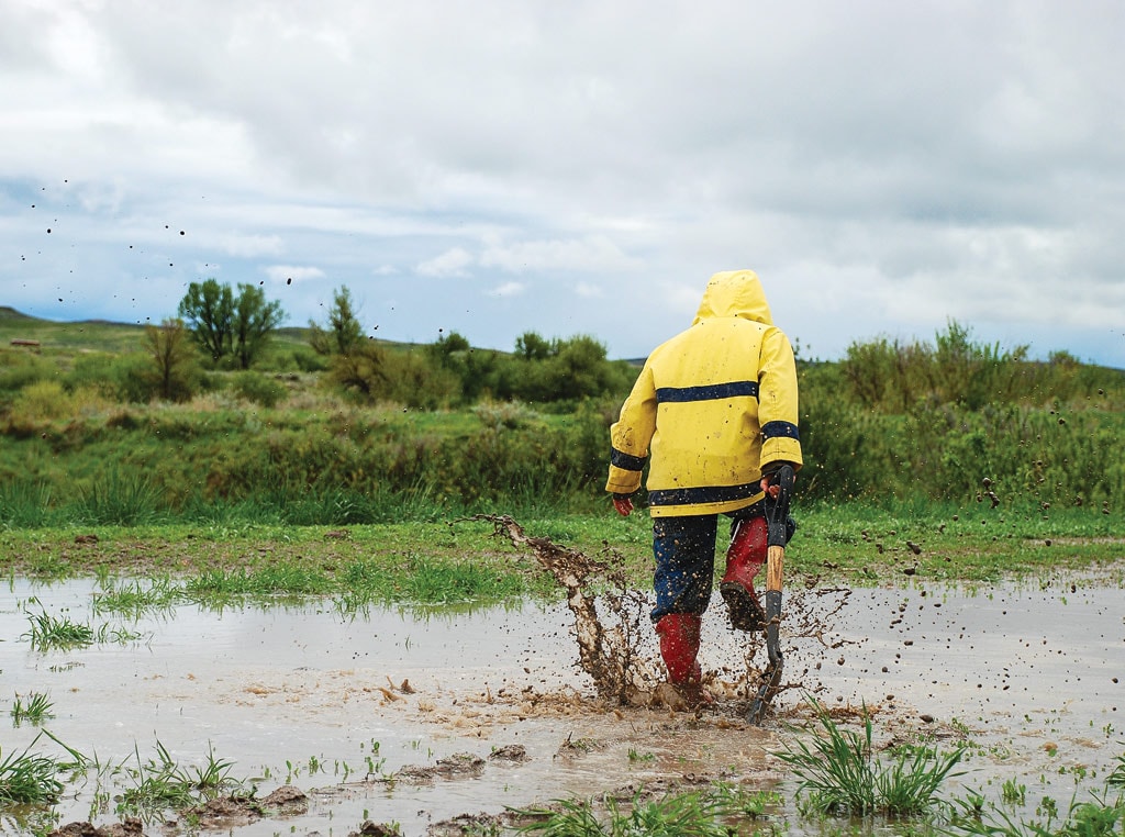 Person stomping in puddles