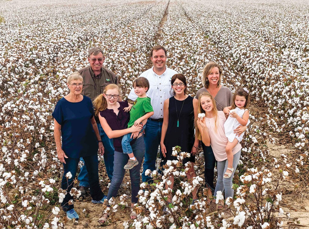 Jeremy and Elizabeth Jack (in white and black in center) surrounded by their family – all an integral part of their operation.