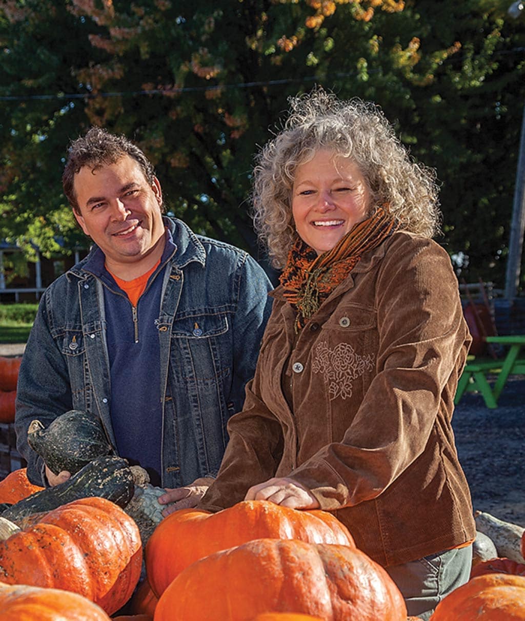 family looking at pumpkins