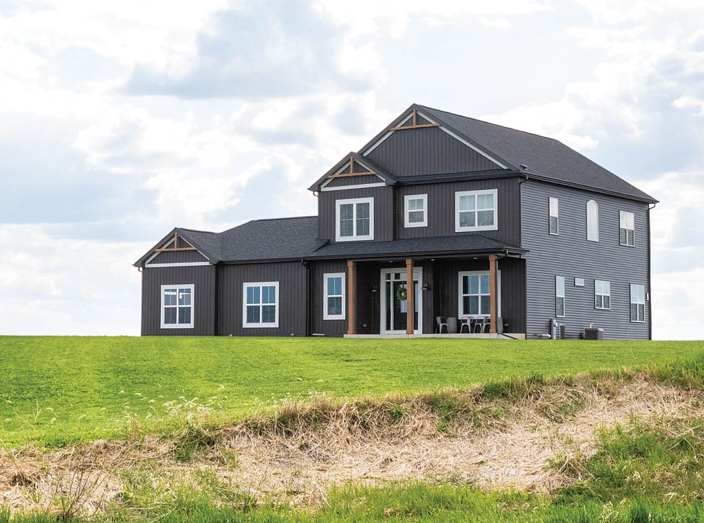 new farmhouse on a hill