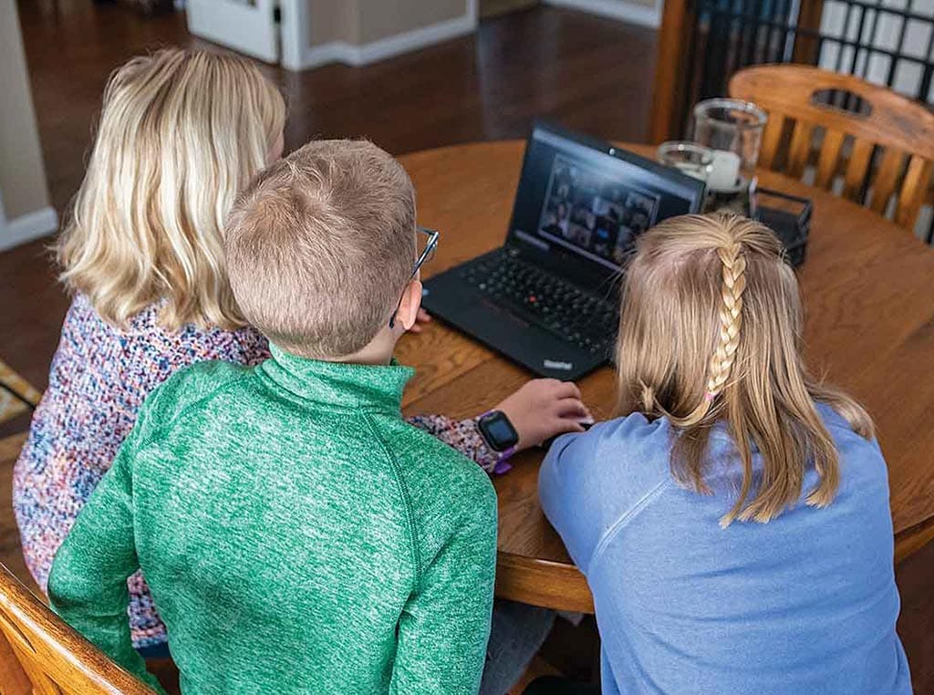 Kids sitting at laptop computer