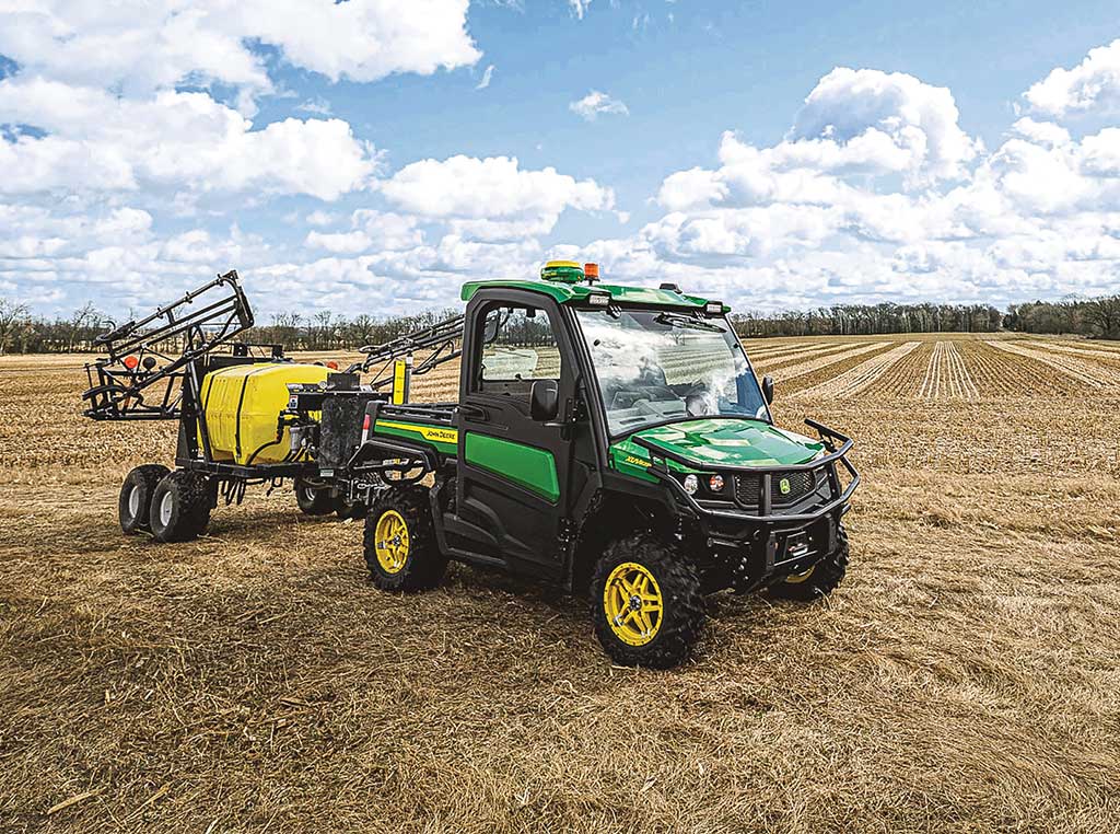 Deere Gator Utility Vehicle in field