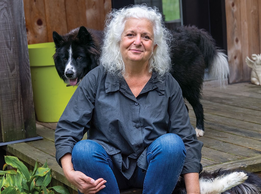 Women sitting with dogs