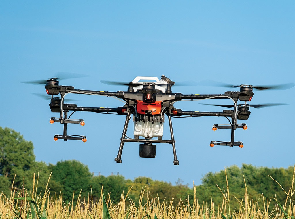 Drone flying above field