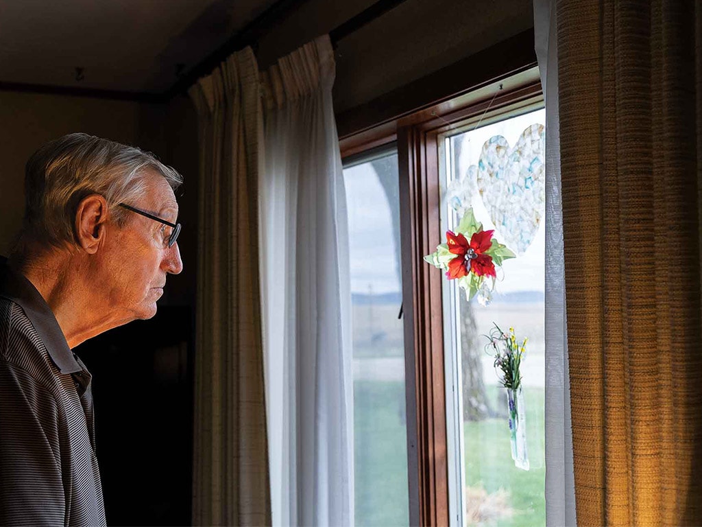 person looking outside a window