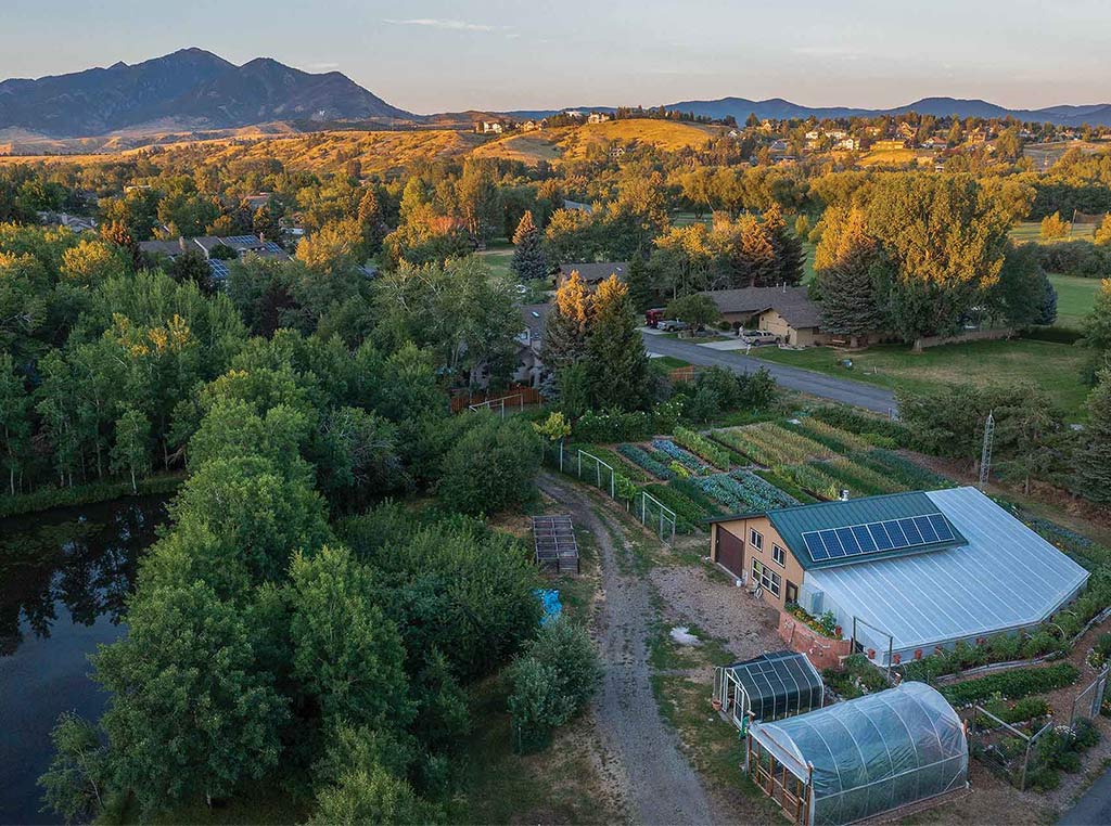 aerial view of community gardening complex with hills in the distance