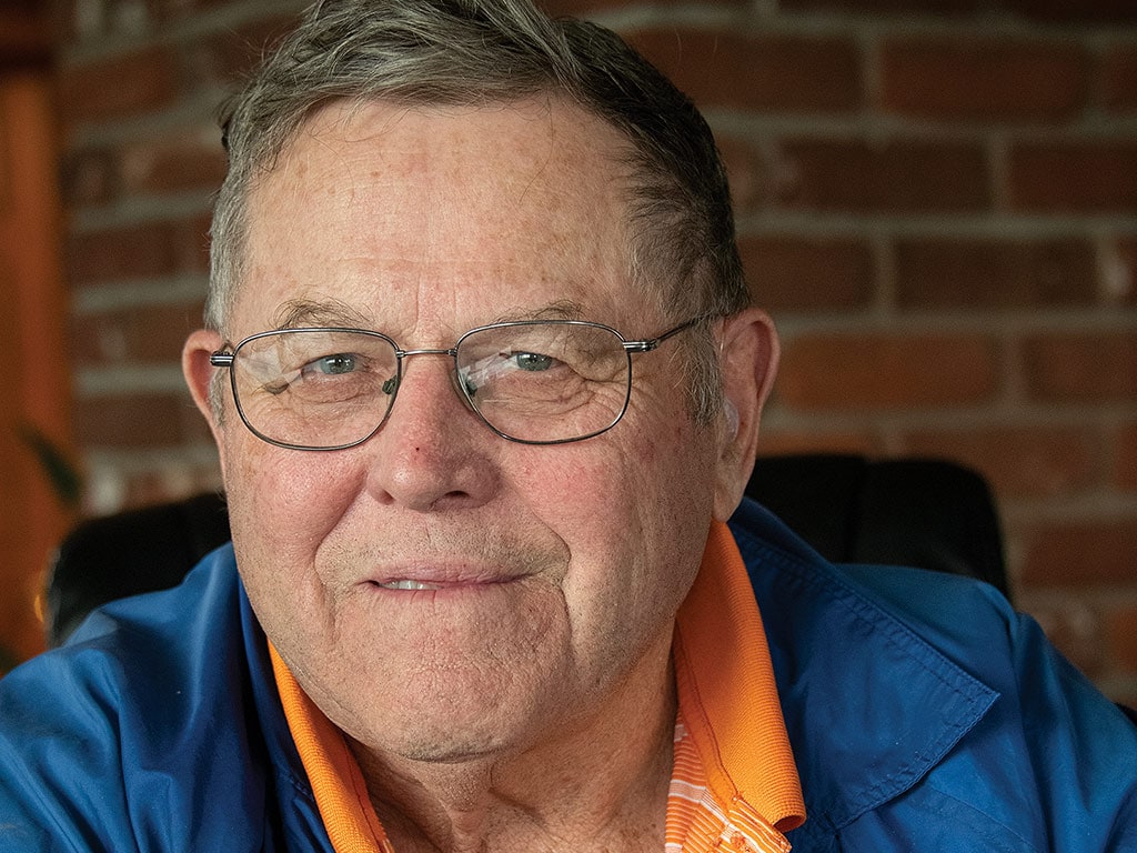 closeup of smiling person with glasses