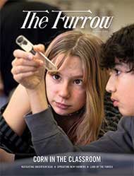 two young people inspecting a test tube