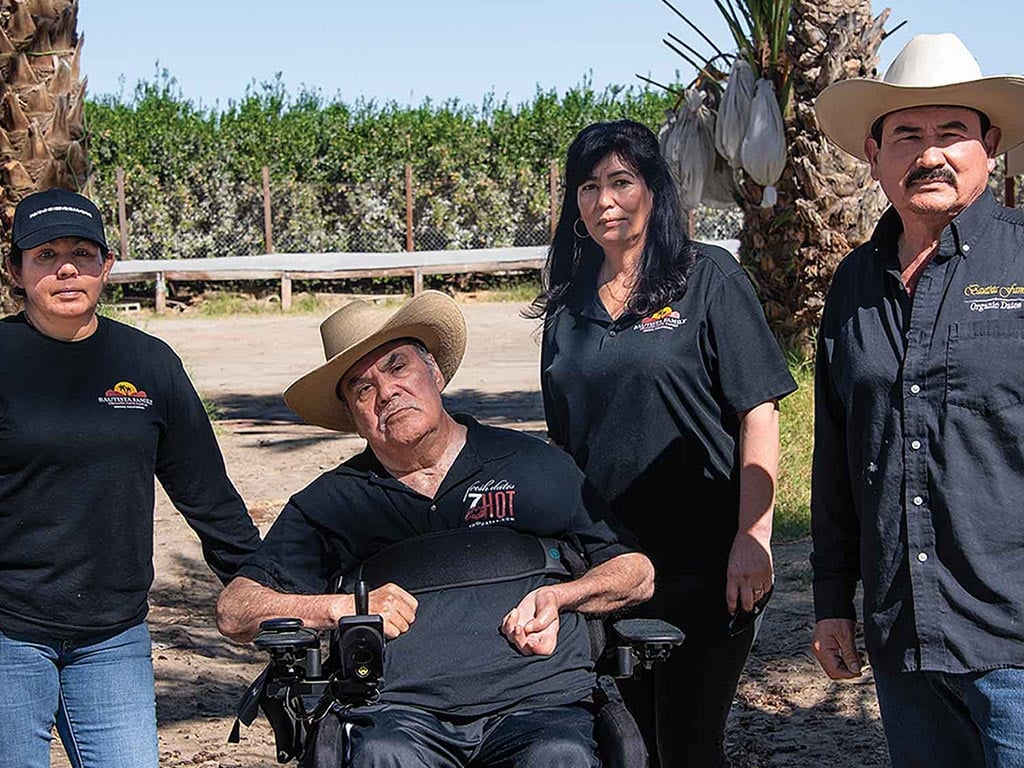 The Bautistas family around palm trees