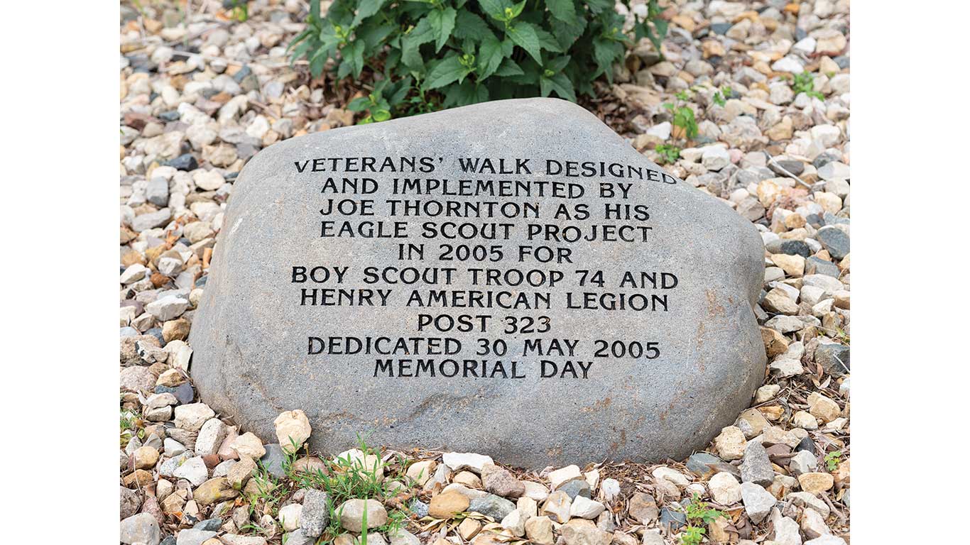 Engraved stone marks the Veterans Walk dedication.