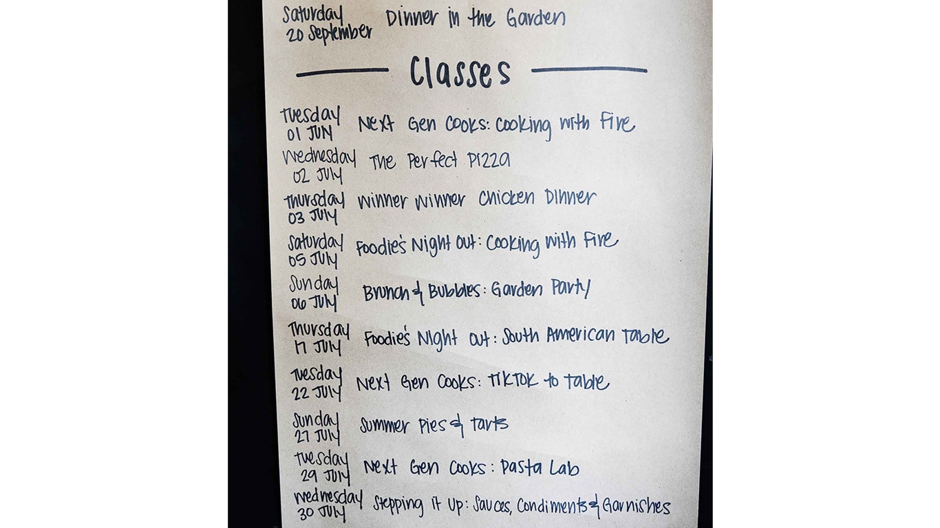 Handwritten schedule of cooking classes on a white sheet of paper.