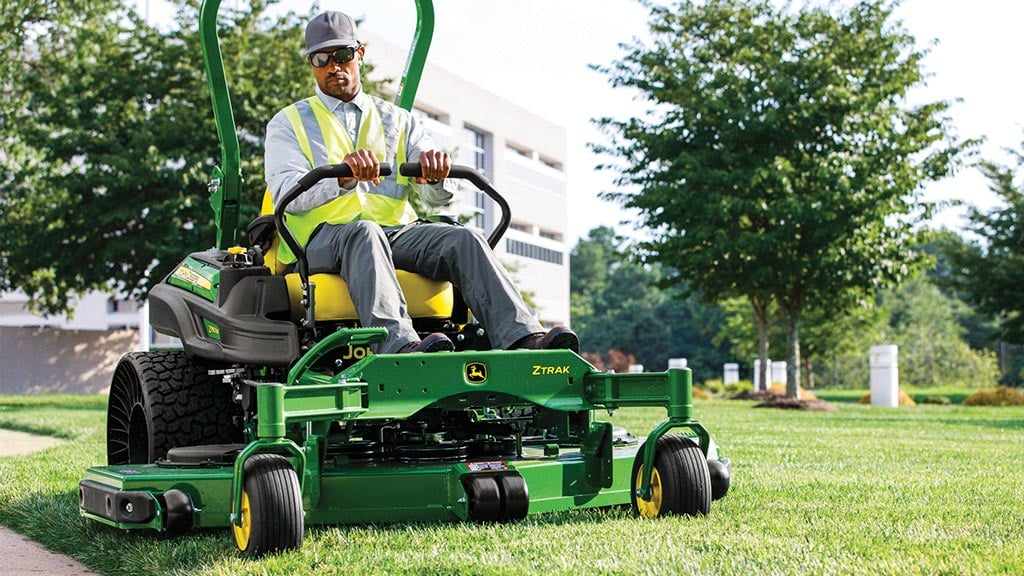 Man mowing with a zero-turn mower