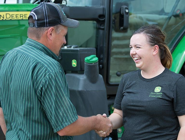 Customer and dealer shaking hands